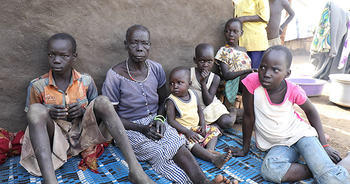 Grandmother and her grandchildren in Bidibidi Camp in Uganda